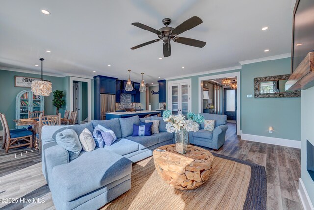 living area with a ceiling fan, recessed lighting, and light wood finished floors