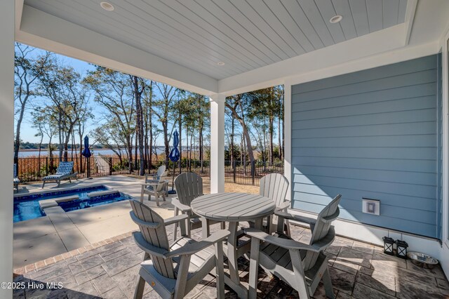 view of patio featuring a fenced backyard, grilling area, and a fenced in pool