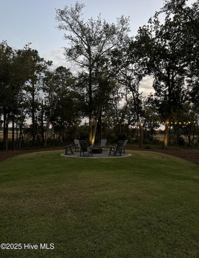 view of yard featuring a fire pit