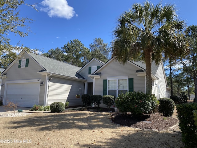 view of front of home with a shingled roof