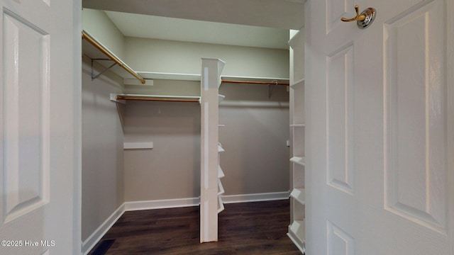 spacious closet featuring visible vents and wood finished floors