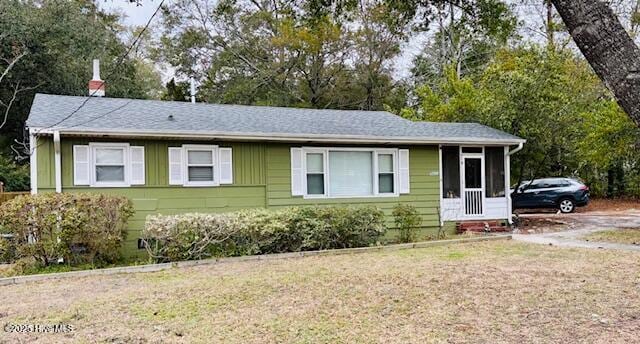 ranch-style home featuring a front yard