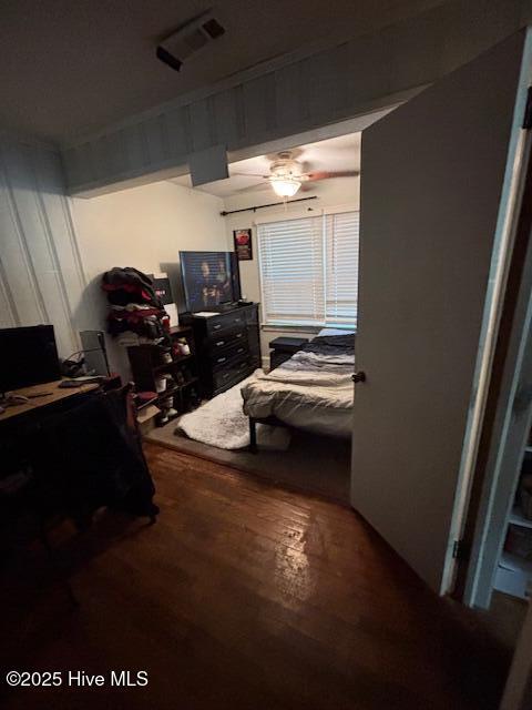 bedroom with wood finished floors and visible vents