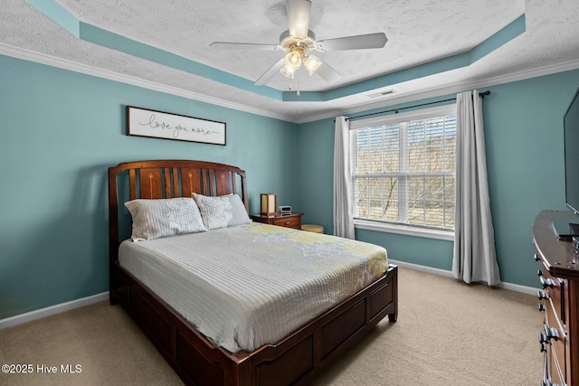 bedroom featuring light carpet, baseboards, a raised ceiling, and a textured ceiling