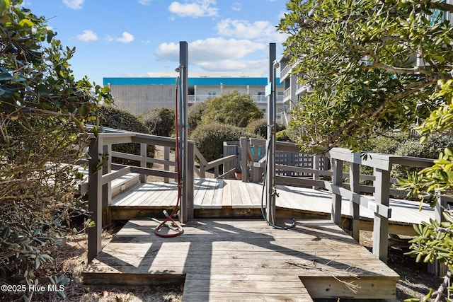 exterior space with a deck with water view