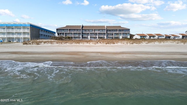 view of building exterior with a water view