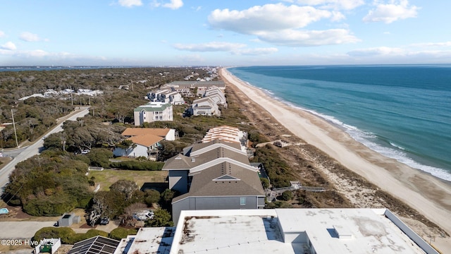 aerial view with a water view, a residential view, and a view of the beach