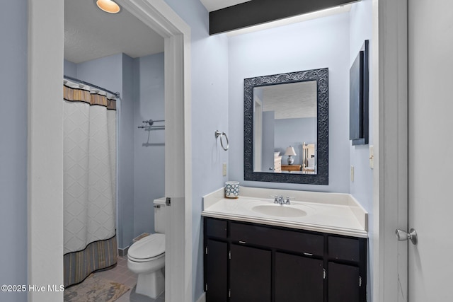 full bath featuring toilet, tile patterned flooring, and vanity