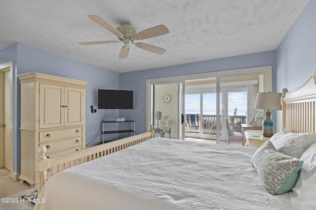 bedroom featuring light carpet, access to exterior, ceiling fan, and a textured ceiling