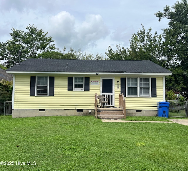 ranch-style house with a front lawn, crawl space, and fence