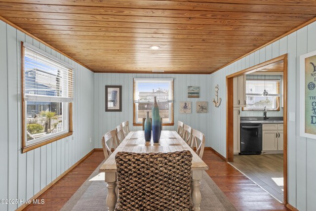 kitchen featuring light wood finished floors, appliances with stainless steel finishes, glass insert cabinets, wood ceiling, and white cabinetry