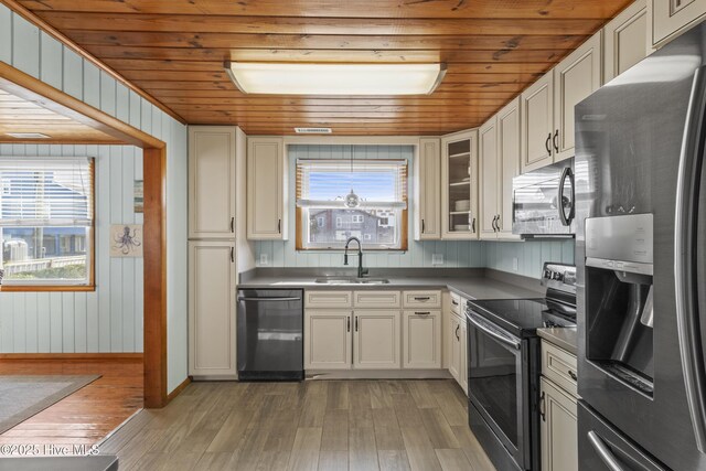 bedroom with multiple windows, wooden ceiling, wood finished floors, and visible vents