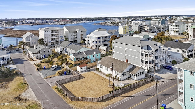 bird's eye view featuring a residential view and a water view