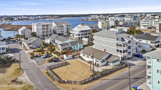 birds eye view of property featuring a water view and a residential view