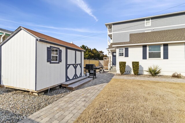 view of side of home with entry steps, a patio area, fence, and crawl space