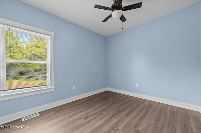 105 Bryan Pl, Washington, NC 27889 - unfurnished room with wood finished floors, baseboards, and a ceiling fan