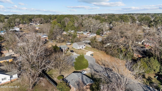 birds eye view of property with a forest view