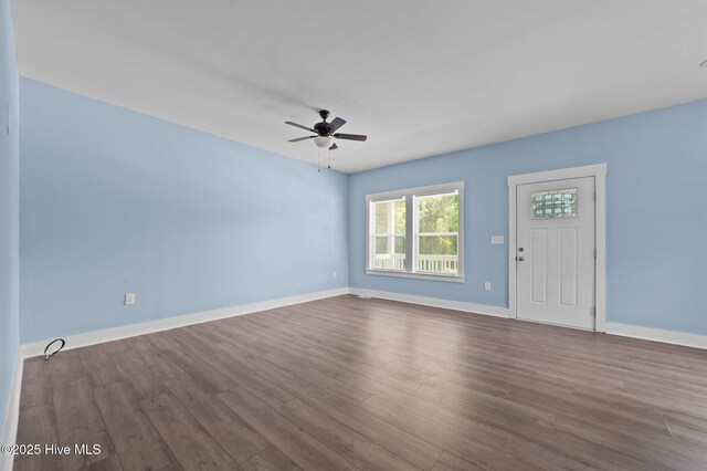 105 Bryan Pl, Washington, NC 27889 - empty room with ceiling fan, dark wood-style flooring, and baseboards