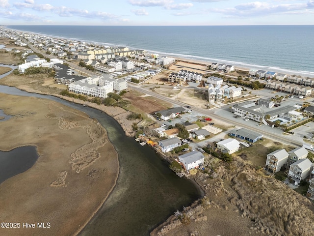 drone / aerial view with a view of the beach and a water view