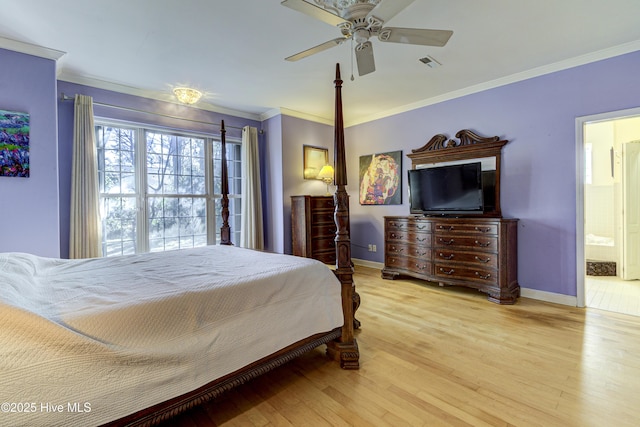 bedroom with light wood-style floors, visible vents, ornamental molding, and baseboards