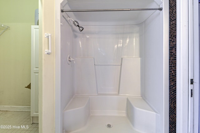 full bath with tile patterned flooring and walk in shower