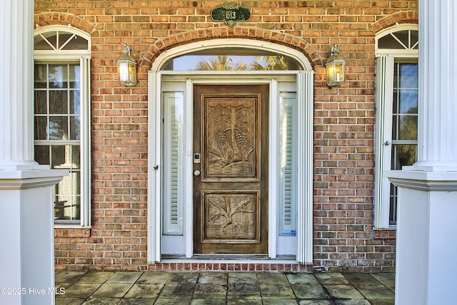 entrance to property with brick siding