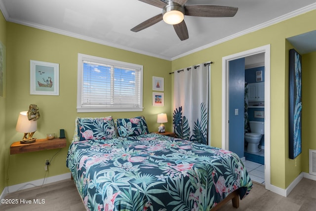 bedroom with ornamental molding, visible vents, and baseboards