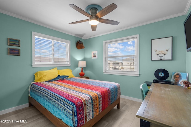 bedroom featuring multiple windows, crown molding, and wood finished floors