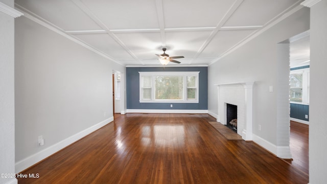 unfurnished living room with a brick fireplace, baseboards, coffered ceiling, and dark wood-type flooring