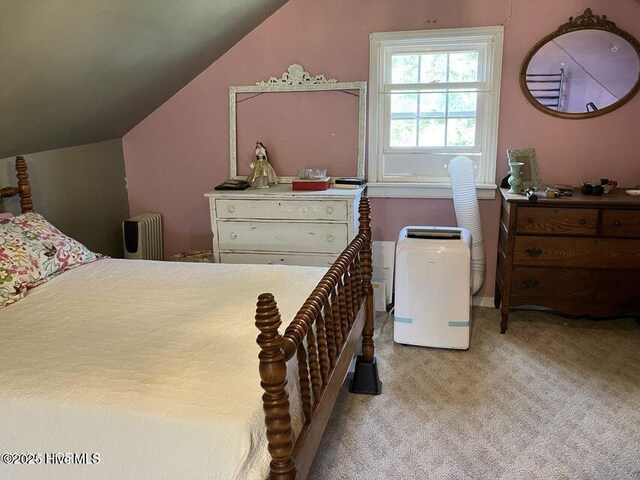 hall with carpet, baseboards, visible vents, and an upstairs landing