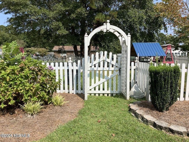 view of gate with fence