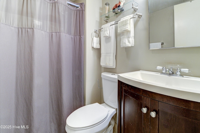 full bathroom featuring toilet and vanity