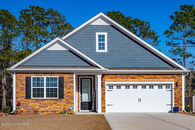 view of front of house with concrete driveway and an attached garage