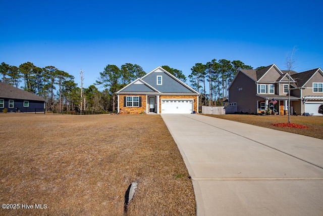 view of front facade with stone siding, a front yard, driveway, and fence