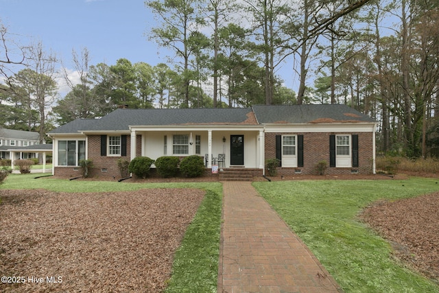 ranch-style home featuring a chimney, brick siding, crawl space, and a front yard