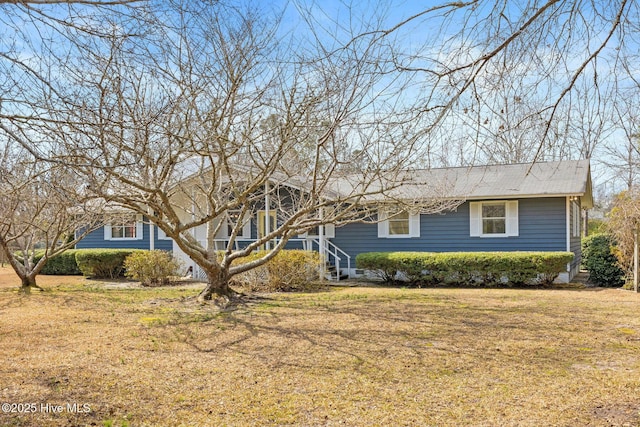 ranch-style home featuring a front yard