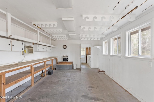 garage featuring a wall unit AC