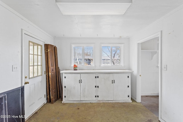 interior space with unfinished concrete floors