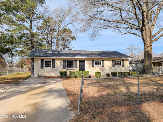 ranch-style house featuring a fenced front yard