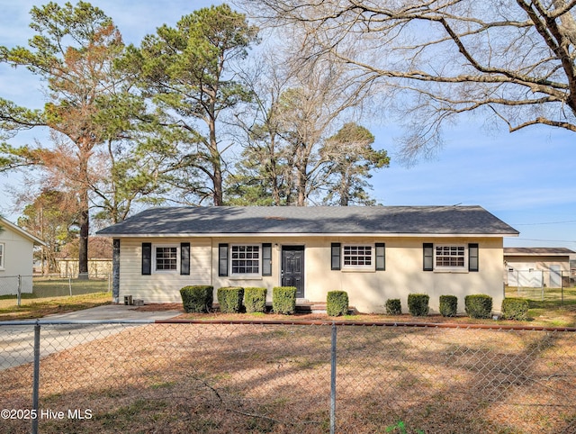 ranch-style house with a fenced front yard and stucco siding