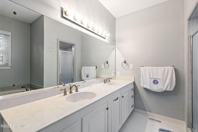 full bathroom with visible vents, a sink, double vanity, and a shower stall