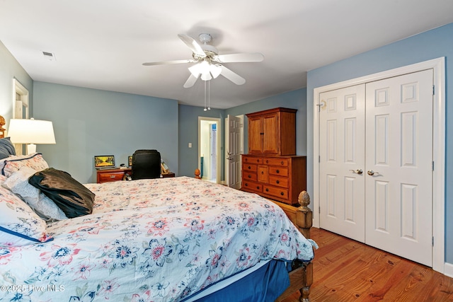 bedroom with ceiling fan, a closet, and light wood-type flooring