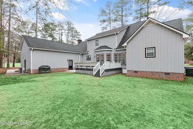 back of property featuring crawl space, a shingled roof, central AC unit, and a wooden deck