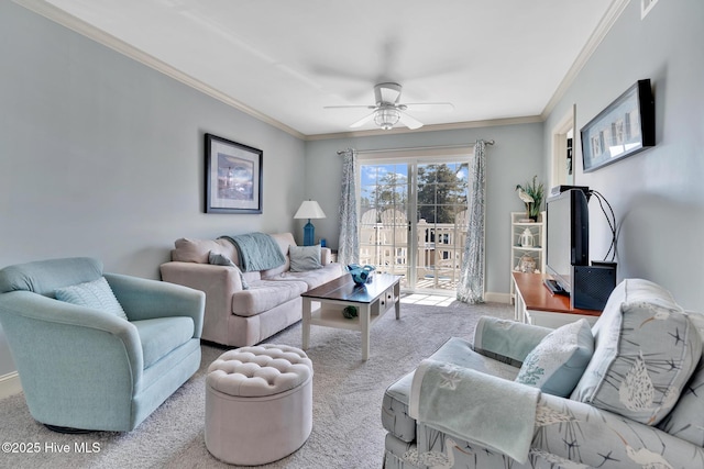 living area with ceiling fan, ornamental molding, baseboards, and light colored carpet