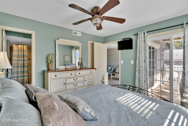 bedroom featuring ensuite bath, ceiling fan, and visible vents