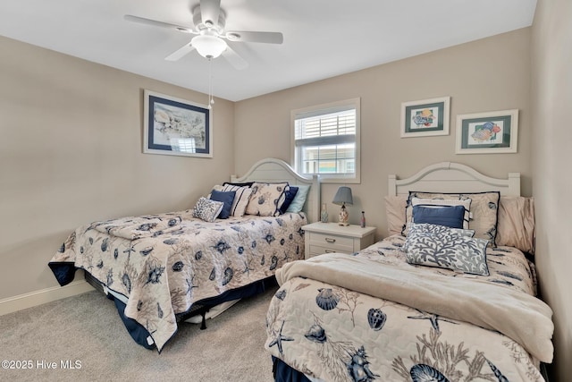 bedroom with baseboards, ceiling fan, and light colored carpet