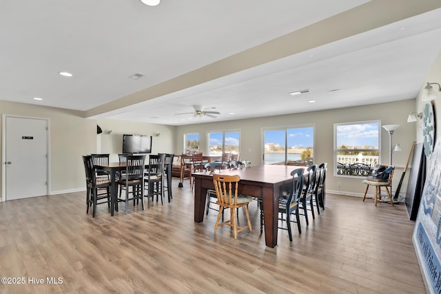 dining room featuring light wood-style flooring, visible vents, baseboards, and recessed lighting