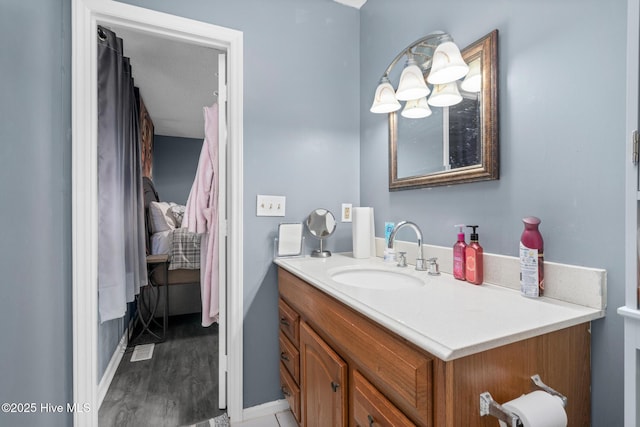 bathroom featuring vanity and baseboards