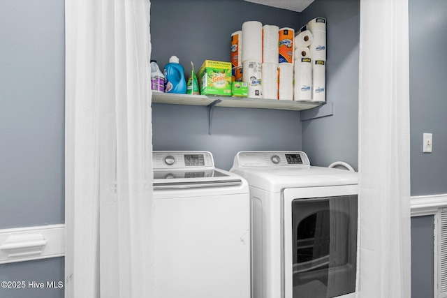 laundry area with laundry area and washer and dryer