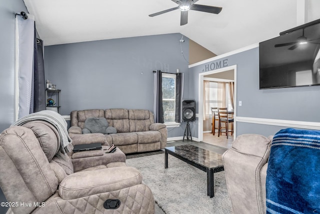 living room featuring ceiling fan, baseboards, and vaulted ceiling